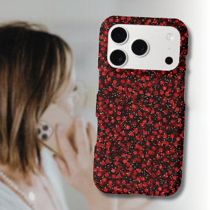 Confettis rouges élégants sur fond noir pailleté