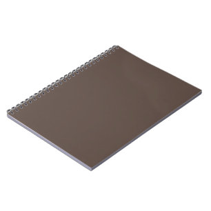 Confidently Against a Stylish Brown Wall Notebook
