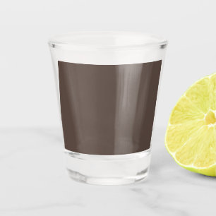 Confidently Against a Stylish Brown Wall Shot Glass