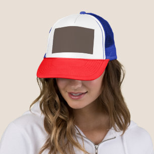 Confidently Against a Stylish Brown Wall Trucker Hat