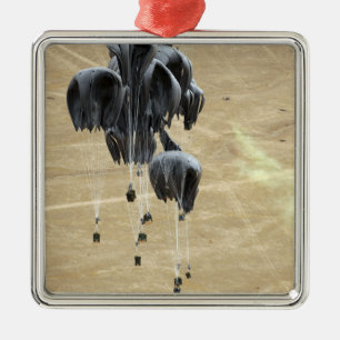 Container delivery system bundles parachute metal ornament