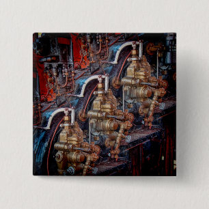 Controls of a steam locomotive engine badge. 2 inch square button