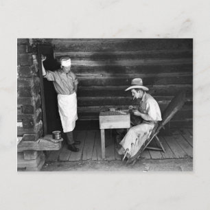 Cook watching a cowboy play cards