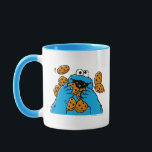 Cookie Monster Eating All the Cookies Mug<br><div class="desc">Satisfy your cravings for fun and cookies with this graphic featuring the one and only Cookie Monster! This showcases a vibrant illustration of Cookie Monster in his element, happily devouring a pile of chocolate chip cookies with crumbs flying everywhere. This classic and instantly recognizable design is cheerful, playful, and sure...</div>
