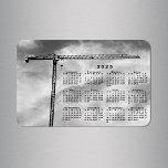 Cool Construction Crane Photo 2025 Calendar Magnet<br><div class="desc">Keep all the dates of the year handy with a black 2025 calendar over a cloudy sky in a black and white photograph of a construction crane. Makes a cool stocking stuffer! The crane looks like a lopsided T, its narrow black arm stretching out to the right. Turbulent wispy clouds...</div>