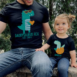 Cool Dino Daddysaurus Rex New Dad Father's Day T-Shirt<br><div class="desc">Customizable text design with a cool modern teal T-rex in sunglasses holding a heart,  gift for Father's day,  Birthday,  or Christmas. Find a matching child's dinosaur shirt in my collection "daddy and me designs".</div>
