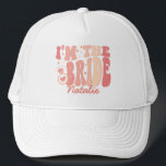 Cool It's Me Hi I'm the Bride Its Me Personalized Trucker Hat<br><div class="desc">Introducing the Cool It's Me Hi I'm the Bride It's Me Personalized Trucker Hat – a trendy and cute accessory in a delightful peach coral pink shade that captures the essence of your bride era. This personalized trucker hat is not just a fashion statement but a symbol of your upcoming...</div>