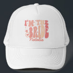 Cool It's Me Hi I'm the Bride Its Me Personalized Trucker Hat<br><div class="desc">Introducing the Cool It's Me Hi I'm the Bride It's Me Personalized Trucker Hat – a trendy and cute accessory in a delightful peach coral pink shade that captures the essence of your bride era. This personalized trucker hat is not just a fashion statement but a symbol of your upcoming...</div>