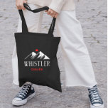 Cool Whistler Canada Mountains Maple Leaf Dark Tote Bag<br><div class="desc">Shows two mountain peaks,  Whistler and Canada below,  and a Canadian maple leaf above. Cool,  slick white and red design.
For people who love to ski and snowboard in Whistler,  an attractive winter playground in British Columbia. Awesome souvenir of your vacation.</div>