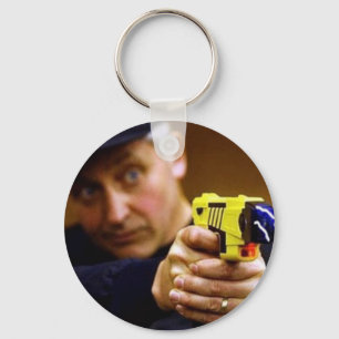 Cop With A Taser Gun Keychain