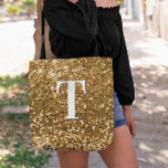 Copper Gold Faux Glitter Bokeh Sparkly Monogram Tote Bag<br><div class="desc">A modern bold single letter monogram in white with a black drop shadow. The font size, colour and style are customizable. The background is a faux copper gold glitter with sparkly spots or bokeh. Move or delete the tiny faux sparkle graphic images. Golden coppery gift for a bridesmaid or other...</div>