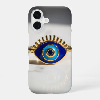 Coque iPhone 16 Bague en or d'oeil maléfique sur fond de marbre