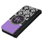 Motif de monogramme violet de Damas noir