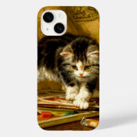 Kitten avec peinture et brosses