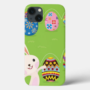 Etui iPhone 13 Lapin de Pâques jouant avec des oeufs peints