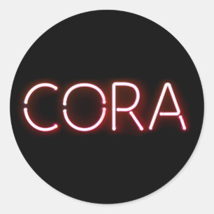 Cora name in glowing neon lights classic round sticker