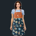Coral & Blue Floral Pattern Family Monogram Apron<br><div class="desc">Orange and blue floral apron monogrammed with your family name,  initial,  and the year your family was established in white fonts against a dark blue background. The floral pattern features blue,  coral,  and pale yellow flowers,  and green leaves and pale berries,  against a dark blue background.</div>