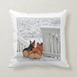 Corgis in the snow throw pillow