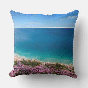 Cornish cliff top view of sea with pink flowers throw pillow