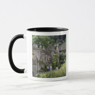 Cotswold stone cottages in the village of mug