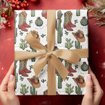 Country Cowboy Howdy Christmas Wrapping Paper<br><div class="desc">This fun and festive Western Howdy Christmas cowboy wrapping paper features hand-drawn illustrations of Xmas cowgirl boots,  hats,  mittens,  cacti,  holly berries and stars in shades of red and green. All against an elegant white background.</div>