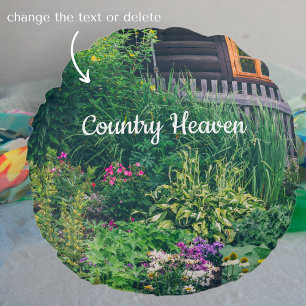 Countryside house with a colourful garden round pillow