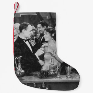 Couple having drink at crowded bar small christmas stocking