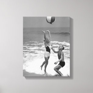 Couple Playing with a Beachball Canvas Print