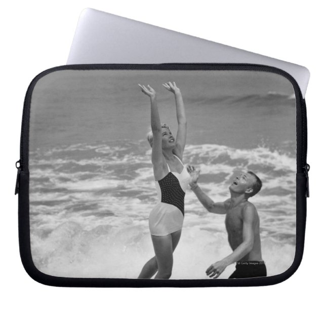 Couple Playing with a Beachball Laptop Sleeve (Front)