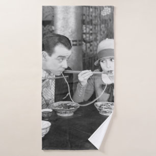 Couple sharing a noodle in a restaurantvintage, fo bath towel