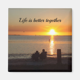 Couple Sit On Beach At Sunset Magnet