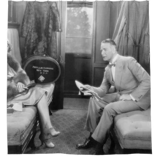Couple sitting together in a compartment of a trai (Front)