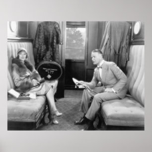 Couple sitting together in a compartment of a trai poster