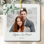 Couples Photo Christmas Ceramic Ornament<br><div class="desc">This Couples Photo Christmas Ornament is decorated with watercolor mistletoe and stylish script typography. Easily customizable with your photo, name, and year. Use the Design Tool to change the text size, style, or colour. Because we create our artwork you won't find this exact image from other designers. Original Watercolor ©...</div>