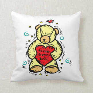 Coussin à mon ours de miel tenant le coeur rouge d'amour