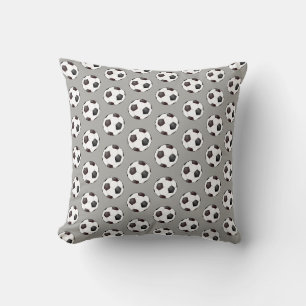 Coussin à motif de ballon de football noir et blan