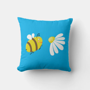 Coussin Abeille mignonne volante avec fleur de marguerite.