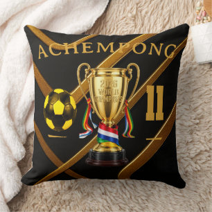 Coussin Achempong Jeux mondiaux 2026 : Trophée Ruban d'Or