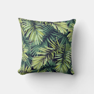 Coussin Arrière - plan vert clair avec plantes tropicaux.