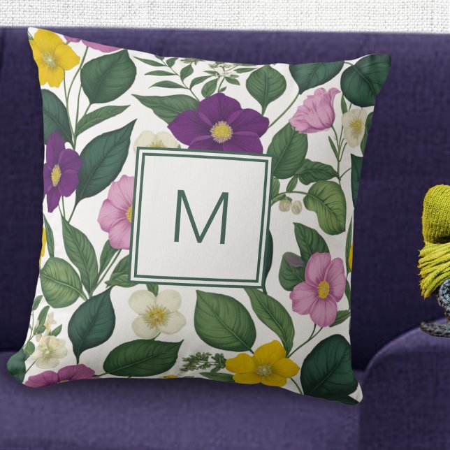 Coussin Belle Elégante Flore Imprimée Fleurs de Printemps (A pretty monogrammed cushion with purple, pink, yellow and white flowers and green leaves)