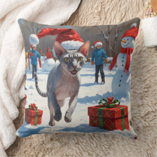 Coussin Chat Sphynx courant dans la neige avec un chapeau 