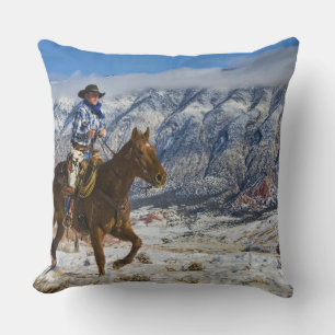 Coussin Cow-boy sur un cheval portant des chaps en cuir