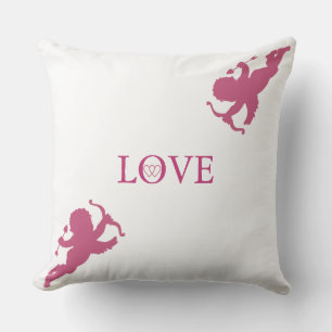 Coussin Cupidons élégants en or rose sur fond blanc