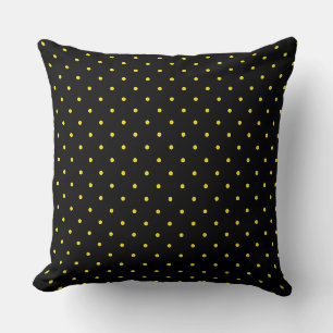 Coussin de jet à pois jaunes sur fond noir