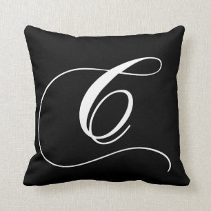 Coussin décoré d'un monogramme de concepteur blanc