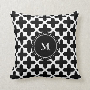 Coussin décoré d'un monogramme de motif blanc noir