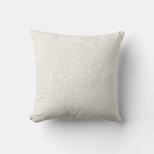 Coussin Élégant blanc sur motif damassé beige pâle