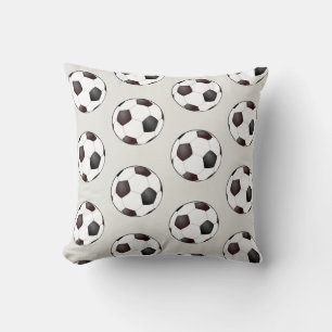 Coussin en forme de ballon de football noir et bla