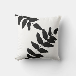 Coussin extérieur noir et blanc de feuillage tropi