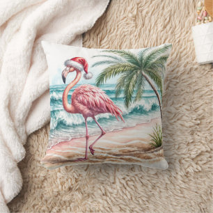 Coussin Flamant rose de Noël sur une plage